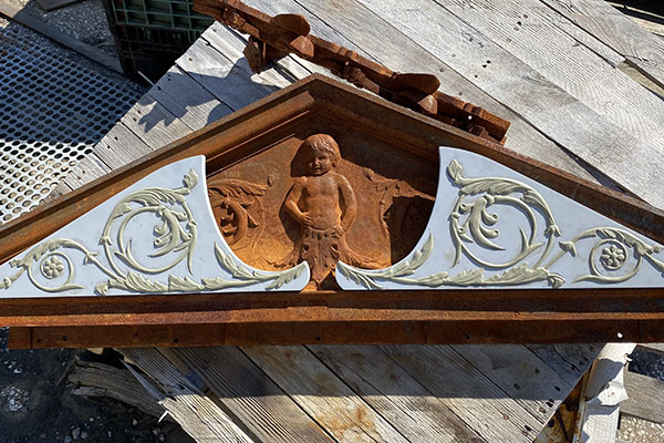 rusted cherub on transom at book tower