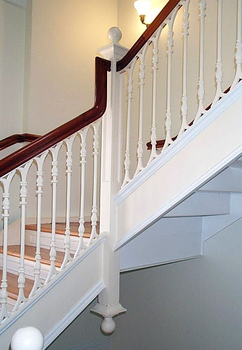 detail of newel post on staircase, white